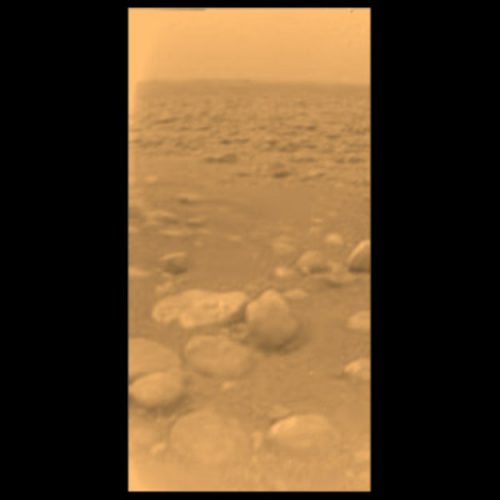 The first-ever images from the surface of Titan showed rounded boulders of rock-hard water ice strewn on an old riverbed or floodplain. Photo Credit: ESA