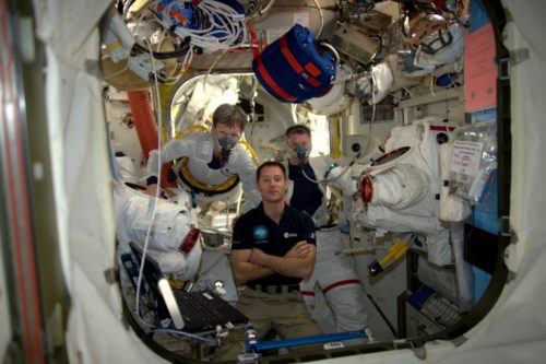 Thomas Pesquet assists Shane Kimbrough and Peggy Whitson as they pre-breathe on masks before EVA-38. Photo Credit: NASA/Thomas Pesquet/Twitter